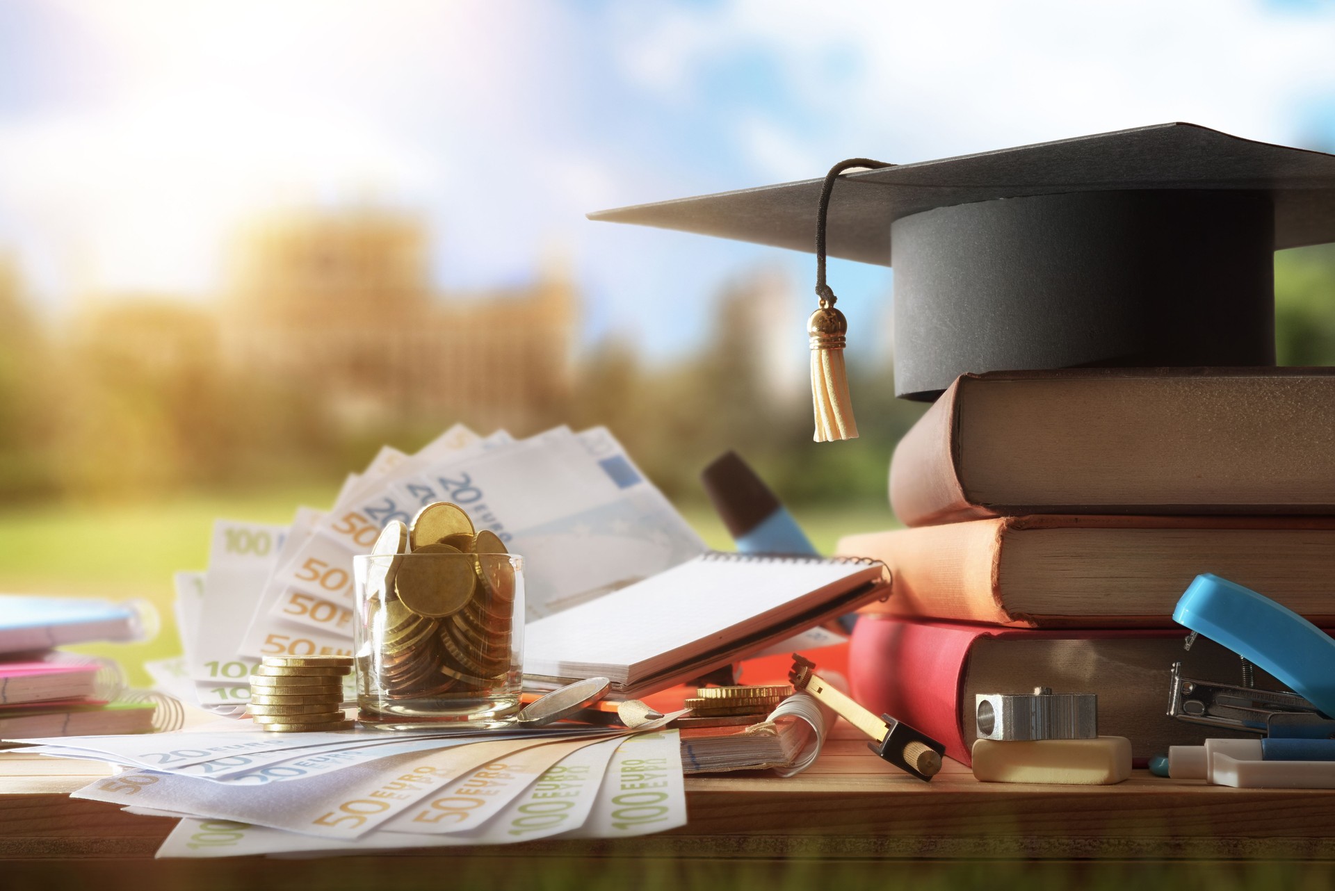 Education cost with books and money outside and educational building